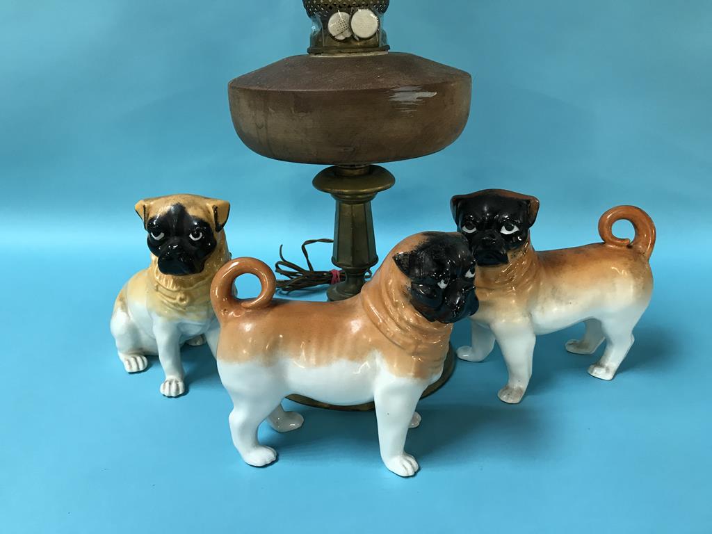 An oil lamp and three porcelain pug dogs - Image 2 of 3