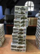 Twelve boxed Tamiya model kits