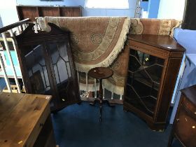 Two corner cabinets and an occasional table