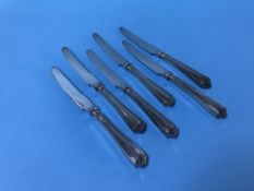 Six silver handled knives