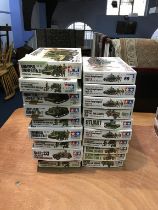 Twenty boxed Tamiya model kits