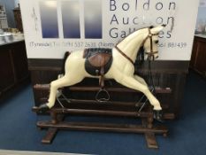 A carved wooden rocking horse
