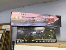 Two boxed model helicopters