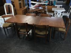 Teak dining table with six chairs, 214cm including leaf (leaf 45.5cm)