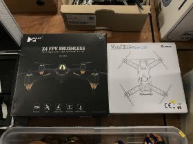 A boxed Eachine Racer 250 drone and a Ubsan X4 FPV drone (2)