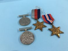 Set of four un-named World War II medals, including France and Germany Star, Defence medal etc