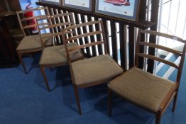 A set of four teak dining chairs