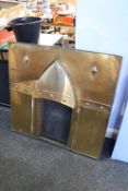 An Arts and Crafts design copper fire surround
