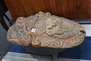 A Victorian cast iron and heavily decorated coal scuttle, in brown enamels