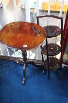 A tripod table and cake stand