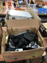 Two boxes of cameras