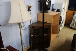 Corner cabinet, two bookcases, a TV, coatstand and two lights