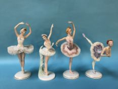 A Coalport ballerina figure and three Franklin Mint figures