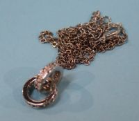 A white metal pendant and chain