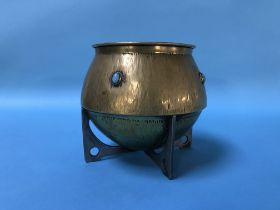 An Arts and Crafts design brass bowl, with turquoise cabochons, supported on a metal pierced base, D