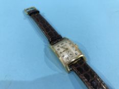 A Gents '14k' Gruen wristwatch, with mock crocodile strap