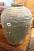 A large terracotta and green painted vase, H 47cm