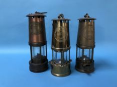 Two Eccles miners lamps and an E. Thomas Williams Ltd lamp (3)