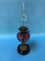 Oil lamp with a cranberry reservoir