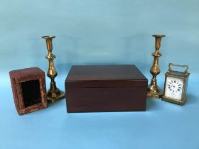 A mahogany work box, a pair of candlesticks and a carriage clock