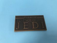 A Star Wars Revenge of the Jedi copper paperweight