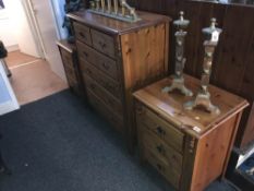 Pine chest of drawers and a pair of pine bedside chests