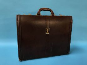 A Burberry of London brown leather case