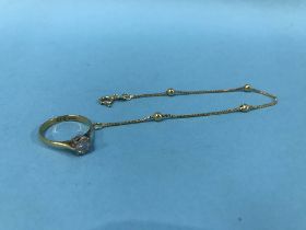 An 18ct ring and chain , 4.4g