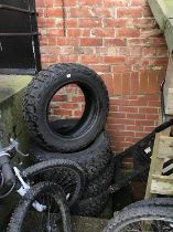 A set of four tyres size R18 119/1160 and a bench