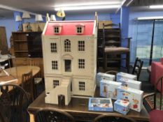 Modern dolls house and boxed accessories