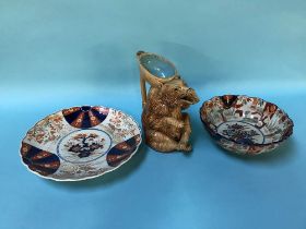 An Imari bowl and wall plate and a bear designed pottery water jug