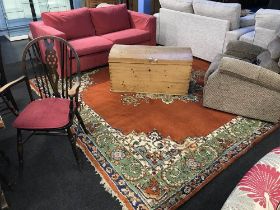 A large burnt orange ground carpet square