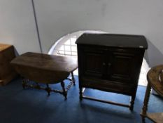 Ercol coffee table and a two door cabinet