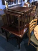 Reproduction bookcase, chess top table and a nest of tables