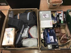 Quantity of cameras and accessories in two boxes