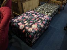 A floral covered footstool
