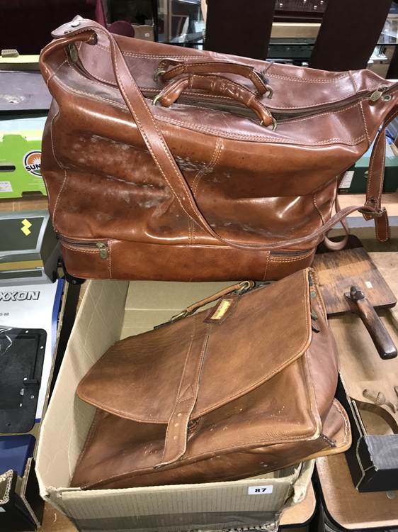 A leather holdall and one other