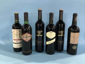 Six various bottles of red wine