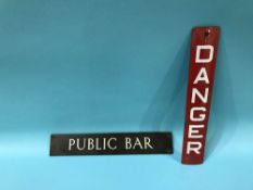 An enamel 'Danger' sign and a 'Public Bar' sign, 31 x 5cm