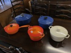 Three Le Creuset pans and two others