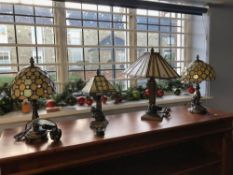 Four Tiffany style lamps