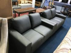 A pair of as new grey leather two seater settees