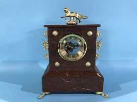 A marble and gilt metal clock