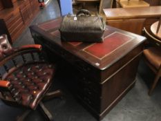 Reproduction mahogany pedestal desk, with secret drawer