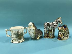 Three boxed Royal Crown Derby paperweights and a boxed loving cup