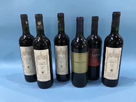 Six bottles of various red wines