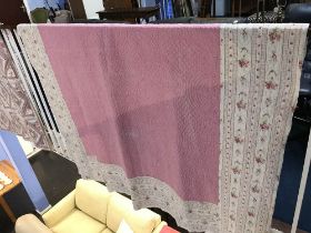 A Durham quilt with pink centre and floral border and a floral reserve