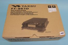 A boxed Yaesu FT-857 D mobile transceiver