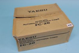 A boxed Yaesu FC - 20 auto antenna tuner (matches FT 847)