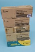 A boxed ICOM IC - M2I, Buoyant Maritime transceiver, an ID-31E, an IC - E90, a BC-177 and a HM-